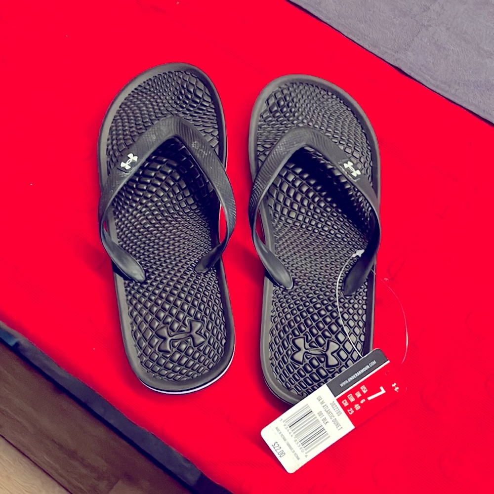Brand new Under Armour flip flops.